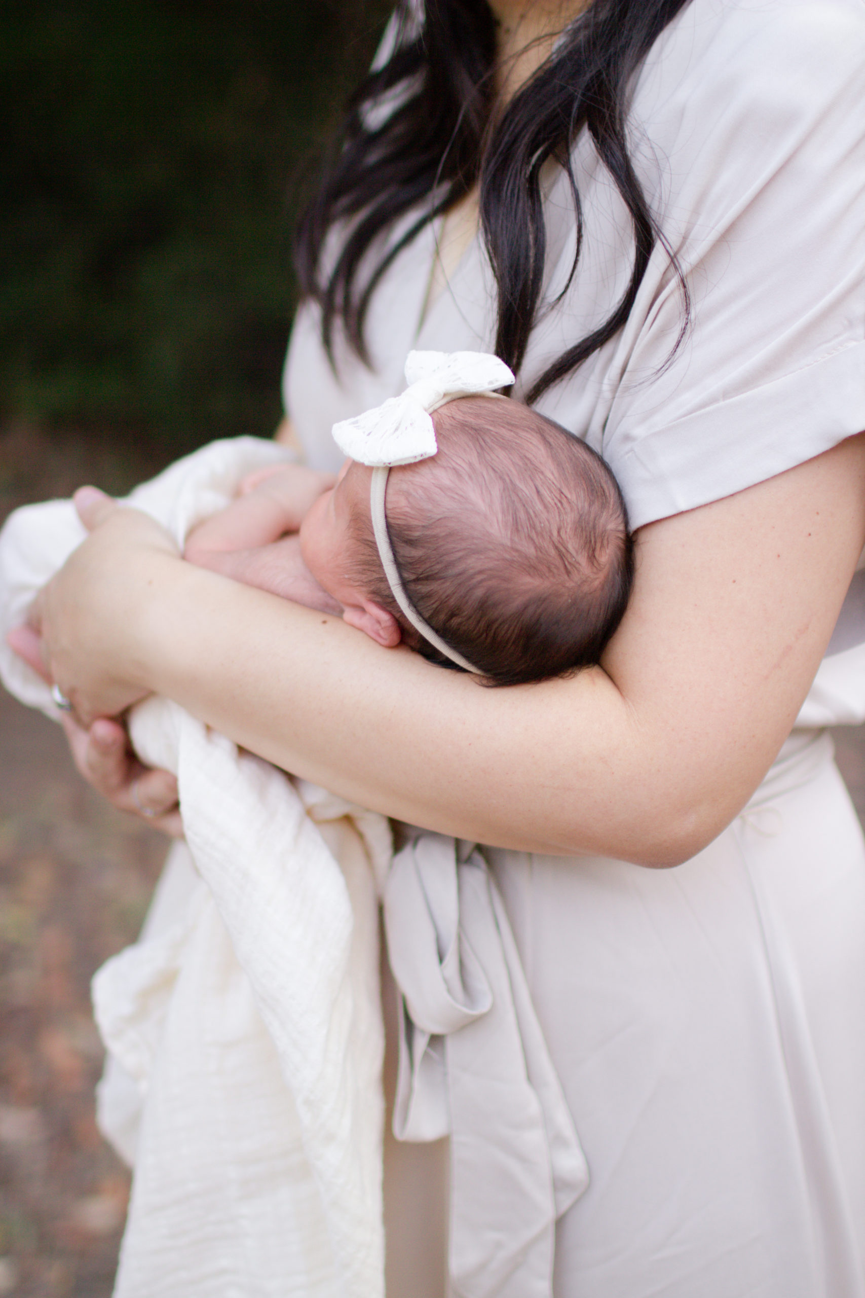 Mother holding Newborn Baby Girl