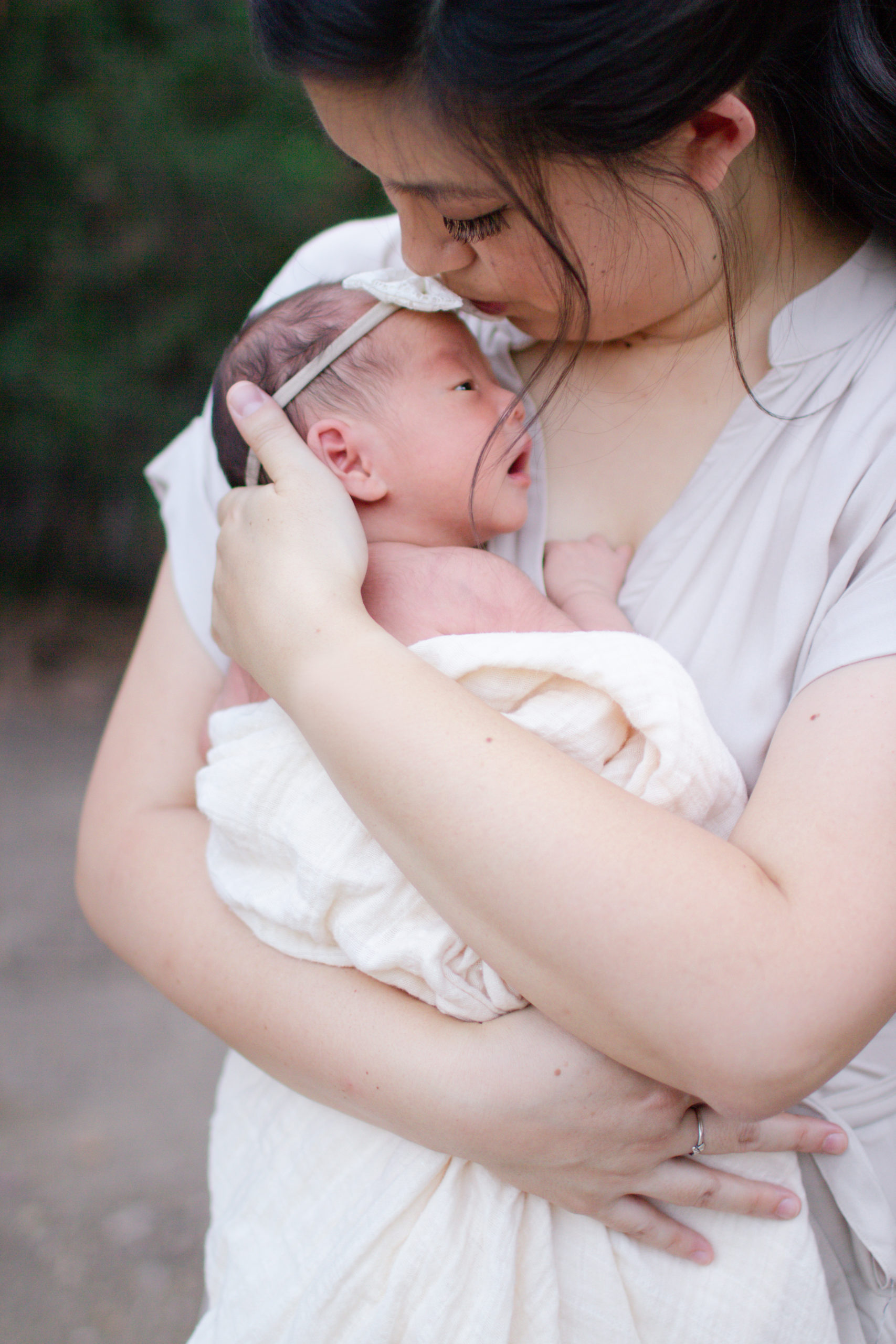 Mother holding Newborn Baby Girl